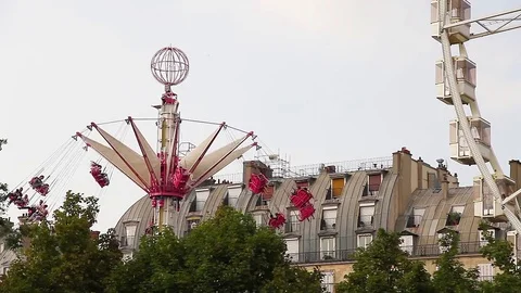 Carousel Turning In Height and Funfair Wheel Stock Footage 72367284