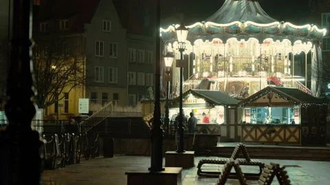 The carousel will glow and spin in the night city Stock Footage 158515063