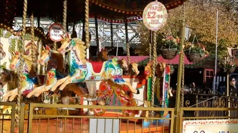 CarouselMerryGoRoundintheSunshine Stock Footage 105880337
