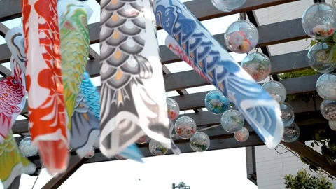 Carp Streamers and Wind Chimes Hanging Under Wooden Pergola Vídeos de archivo 337158204