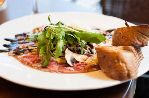 Carpaccio food on the table with bread. Stock Photos