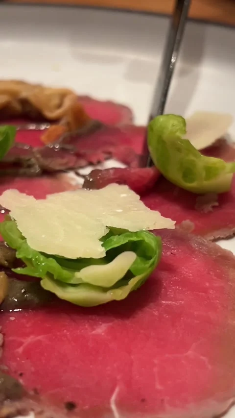 Carpaccio fork knife of Beef with Roasted Baby Beets creamed Horseradish Stock Footage 295704785
