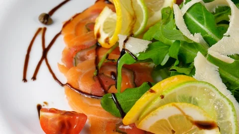 Carpaccio salmon, served with parmesan cheese, lemon Stock Footage 90656792