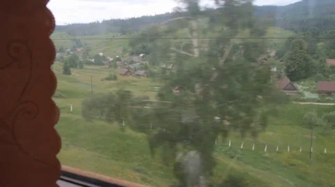Carpathian village from train window Stock Footage 36779212