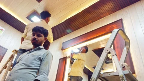 Carpenter Align Timber Panels to Store Upgrade Stock Footage 313277739