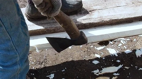 Carpenter aligns the edge of the Board with an ax. Stock Footage 108712956