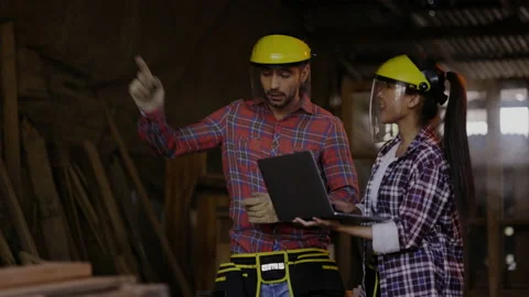 Carpenter and architect are planning construction of built-in furniture in wood  Stock Footage 161164261