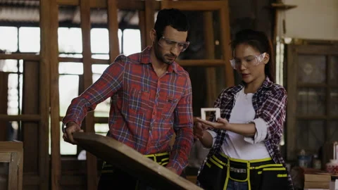 Carpenter and architect are planning construction of built-in furniture in wood  Stock Footage 161174194