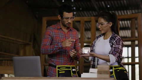 Carpenter and architect are planning construction of built-in furniture in wood  Stock Footage 161174738