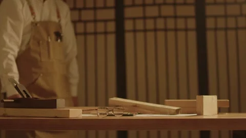 Carpenter in Apron Working at Wooden Workbench with Tools Vidéo 337415125