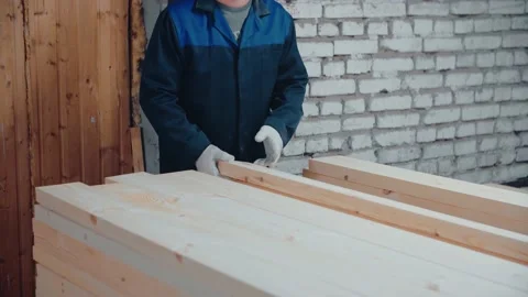 The carpenter arranges the boards neatly. Stock Footage 146265906