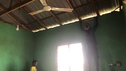 Carpenter Begins Ceiling Installation in Residential Room Stock Footage 315831383
