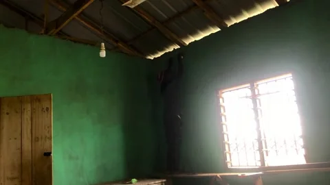 Carpenter Begins Ceiling Installation in Residential Room Stock Footage 315831384
