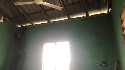 Carpenter Begins Ceiling Installation in Residential Room Stock Footage 319924573