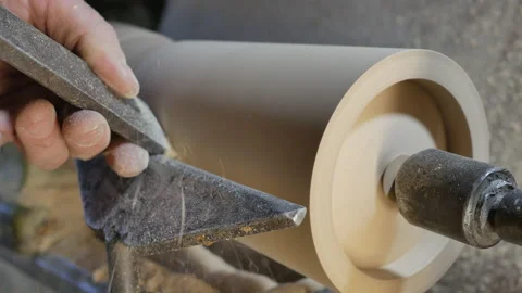 Carpenter with the bevel edged chisel is shaping wooden blank Stock Footage 150556586