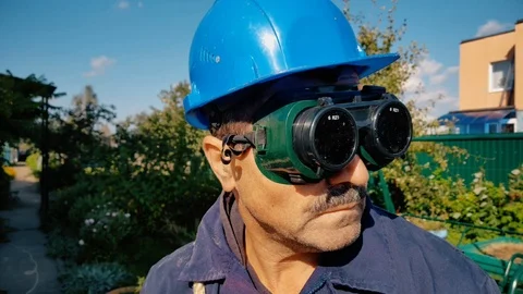 Carpenter in black flip up glasses Stock Footage 99019636