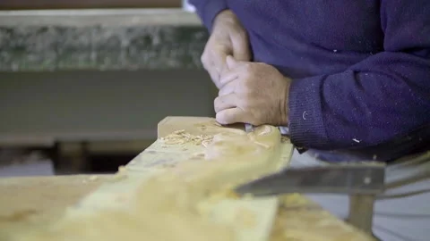 Carpenter carves wood using chisel, slow motion Stock Footage 133159230