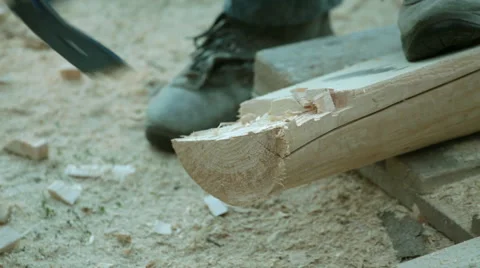 Carpenter carving timber wood using adze Stock Footage 57238633