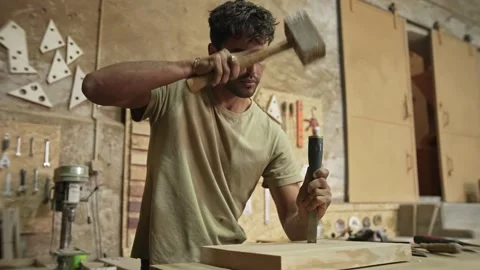 Carpenter carving wood with chisel. Carpentry work at workshop. Joiner woodwork. Stock Footage 271221758