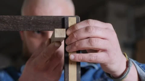 Carpenter Checks The 90 Degree Angle With Try Square. Carpenters Try Square Stock Footage 156683482