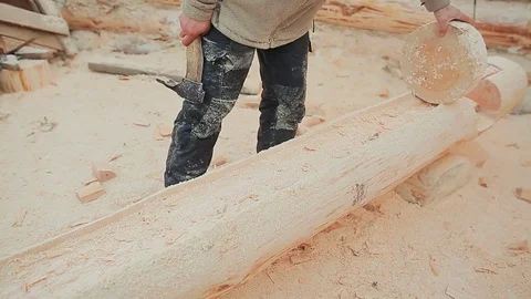 Carpenter checks his work log processing by round billet. Canadian angle masonry Stock Footage 72726364