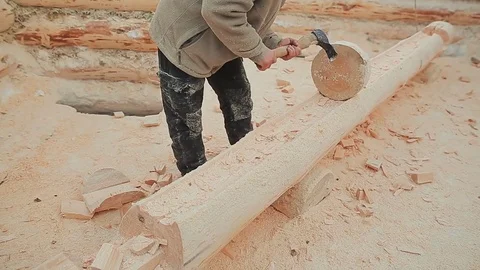Carpenter checks his work log processing by round billet. Canadian angle masonry Stock Footage 72727608