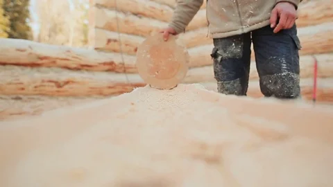 Carpenter checks his work log processing by round billet. Canadian angle masonry Stock Footage 72729288