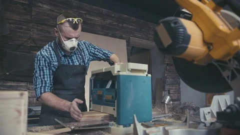 Carpenter with chisel in the hands on the workbench Stock Footage 72728983