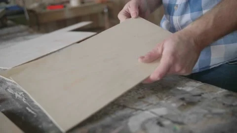 Carpenter chooses material for harvesting Stock-Footage 153495484