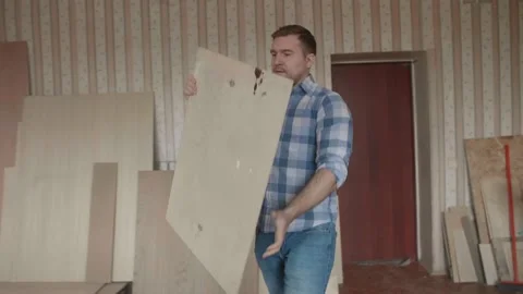 Carpenter chooses material for harvesting Stock-Footage 153495668