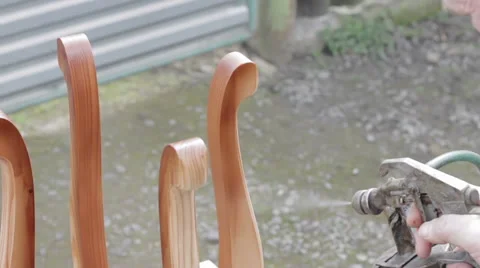 Carpenter is covering stool by lacquer Stock Footage 63273247