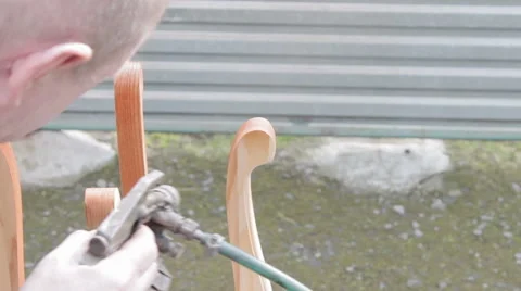 Carpenter is covering stool by lacquer Stock Footage 63319063