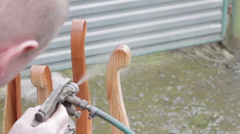 Carpenter is covering stool by lacquer Stock Footage 63319128