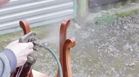 Carpenter is covering stool by lacquer Stock Footage 63319211