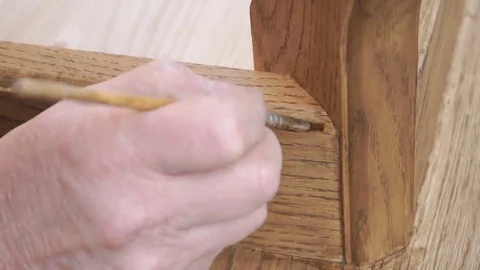 Carpenter is covering table by lacquer Stock Footage 69224894