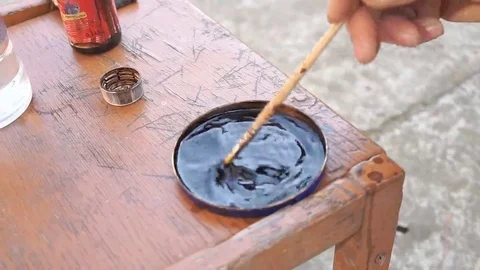 Carpenter is covering table by lacquer Stock Footage 69224986