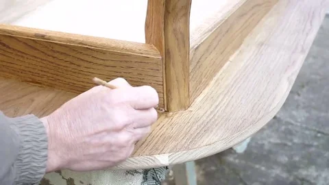 Carpenter is covering table by lacquer Stock Footage 69225129