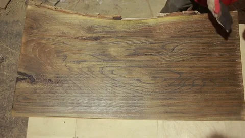 Carpenter covers the mordant plaque, dry wood, accelerated shooting. time lapse Stock Footage 72581815