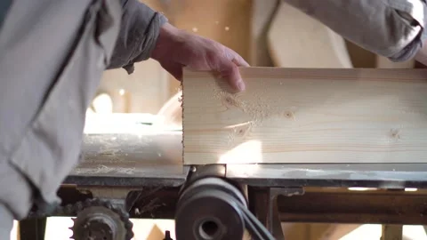 The carpenter cuts the board on a circular saw . Furniture factory Stock Footage 152400675