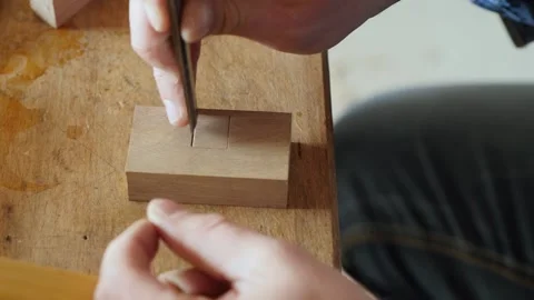 Carpenter cuts a square hole on the board with a chisel.sound of carpentry tools Stock Footage 156683501