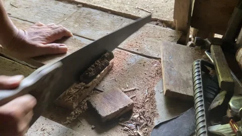 Carpenter cutting lumber with a hand saw. Stock Footage 278903859