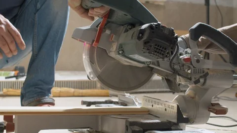 Carpenter cutting a plank with circular saw Video stock 114570393