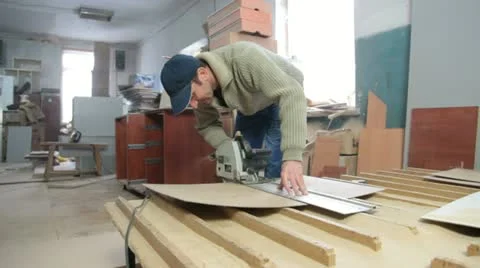 Carpenter cutting wood panel Stock Footage