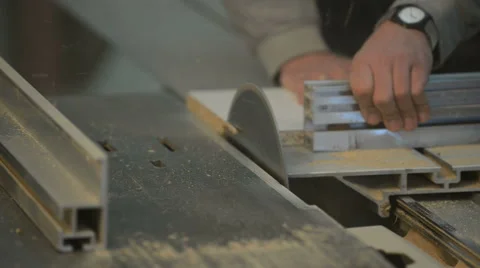 Carpenter cutting the wooden panel with circular saw Stock Footage 43399048