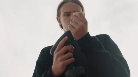 Carpenter demonstrating fastener installation procedures. Creator filming Stock Footage 338004101