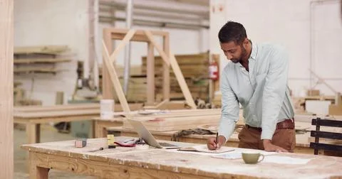 Carpenter, documents and man in workshop, writing and ideas for project pro.. Stockfoto's