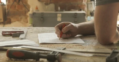 Carpenter doing the drawing, close-up, in the carpentry workshop Stock Footage 74715692