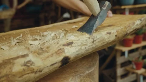 Carpenter doing handmade carpentry on a wooden log Stock Footage 266864683