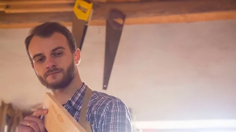Carpenter doing his job in carpentry workshop. Stock Footage 84422858