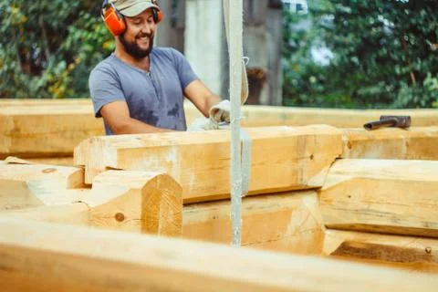 The carpenter is drawing on a tree Stock Photos
